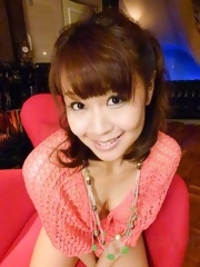 Maika Asian with cans in fishnet blouse puts vibrator on beaver