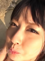 Megumi Haruka Asian with big nude boobs licks cock head outdoor